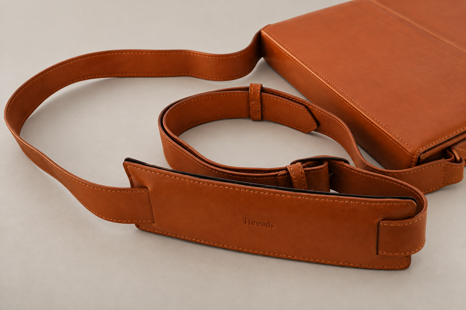 byThreads leather shoulder bag and strap, close up, presentation study